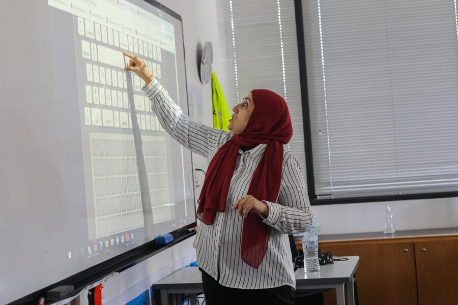 woman teaching on board