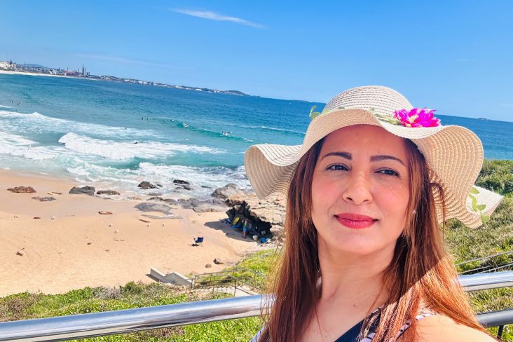 Landscape photo of Jwana standing in front of a beach