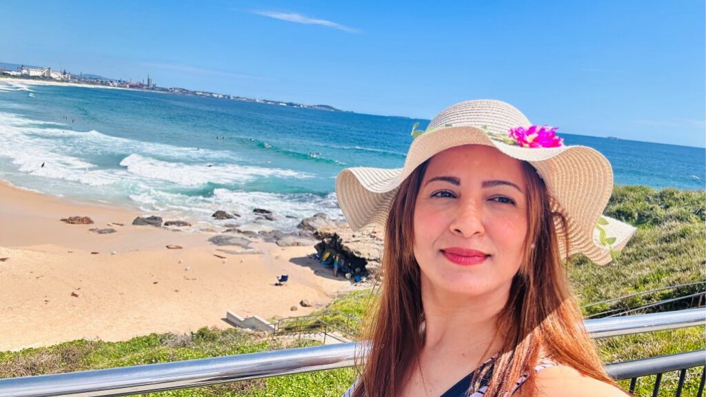 Landscape photo of Jwana standing in front of a beach