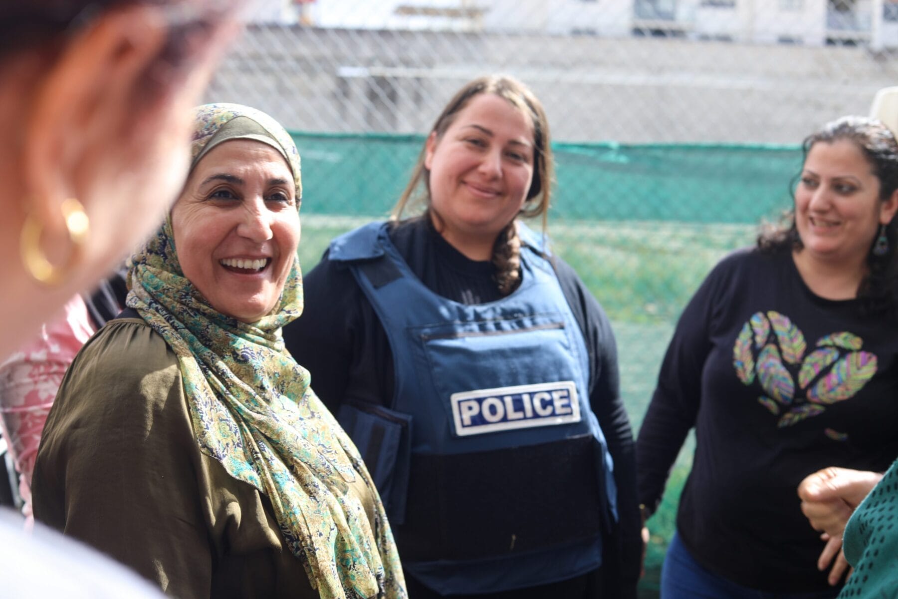 smiling students and policewoman